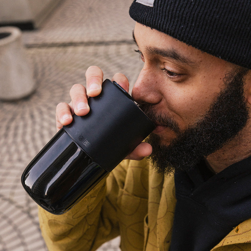 16oz-rise-tumbler-o6 16oz_rise_tumbler_black_man_drink_square.jpg