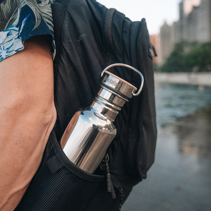 27oz-reflect-with-bamboo-cap-j1 K27SSLRF-MS-BAMBOO_reflect-bottle_backpack_lifestyle.jpg